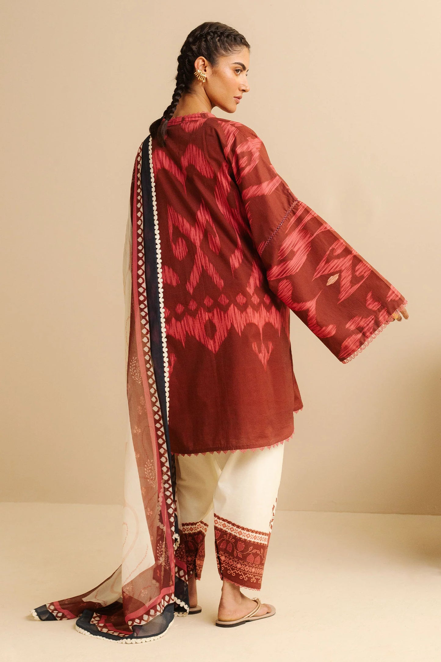 COCO BY ZARA SHAHJAHAN - 3PC UNSTITCHED - A cherry red printed shirt with a dupatta flowing gracefully, paired with white tailored trousers