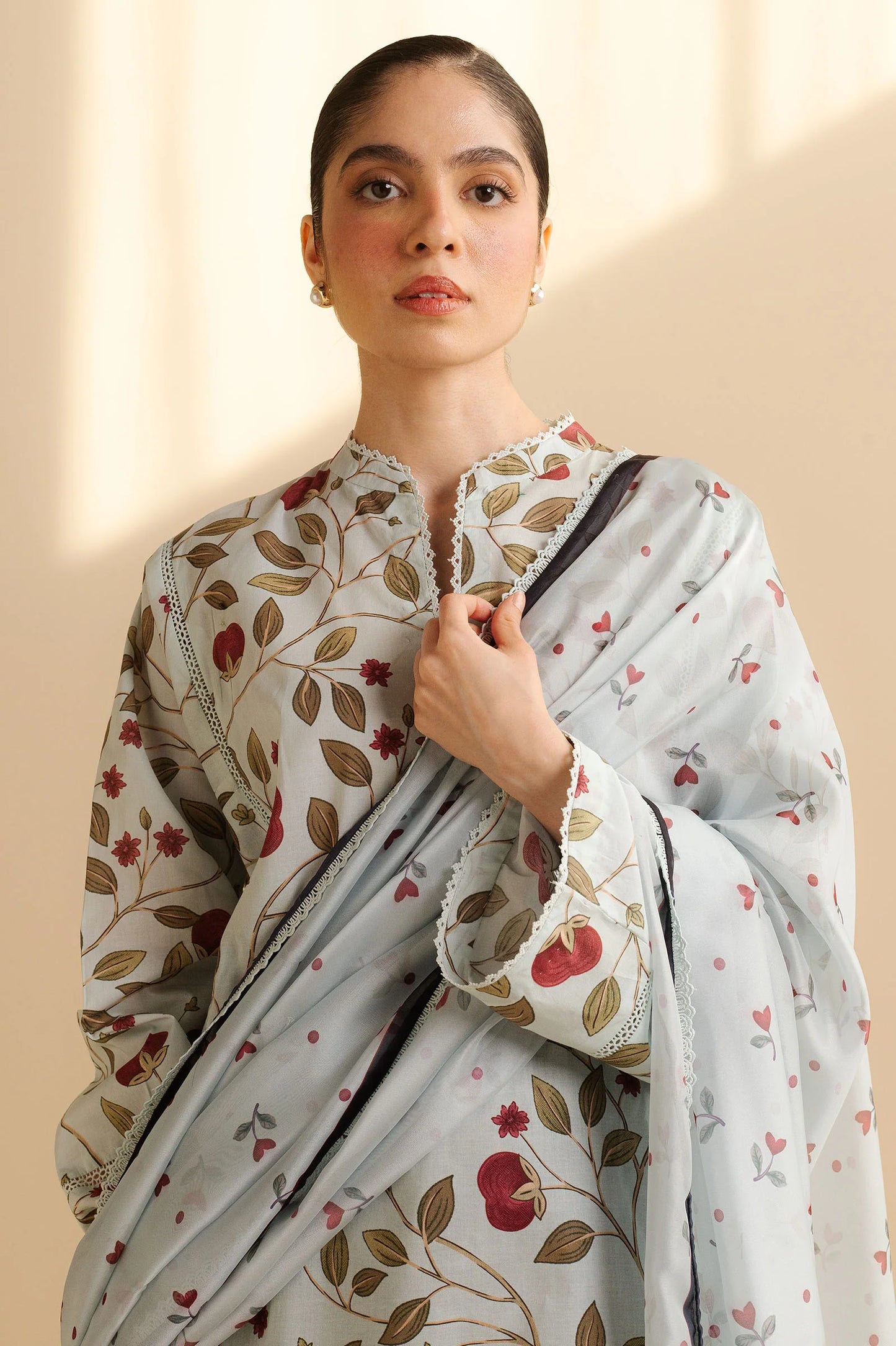 COCO BY ZARA SHAHJAHAN - 3PC UNSTITCHED - A breezy light blue and white shaded shirt adorned with red leaves and intricate patterns, paired with bold black patterned trousers and a simple white dupatta